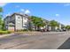 Exterior view of a two story apartment building with parking at 84 S Addison Cottage Way # 213, Murrells Inlet, SC 29576
