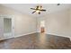 Bedroom with tile floors, access to bathroom and patio at 84 S Addison Cottage Way # 213, Murrells Inlet, SC 29576
