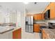 Modern kitchen with granite countertops and stainless steel appliances at 84 S Addison Cottage Way # 213, Murrells Inlet, SC 29576