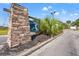 The Addison community entrance with stonework and signage at 84 S Addison Cottage Way # 213, Murrells Inlet, SC 29576