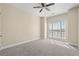 Well-lit bedroom with carpet and window coverings at 84 S Addison Cottage Way # 213, Murrells Inlet, SC 29576