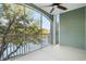 Screened balcony overlooking water with ceiling fan at 84 S Addison Cottage Way # 213, Murrells Inlet, SC 29576
