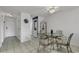 Dining area with glass-top table and four chairs, near kitchen and entryway at 9621 Shore Dr. # G219, Myrtle Beach, SC 29572