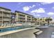 Community pool with plenty of lounge chairs for relaxing at 9621 Shore Dr. # G219, Myrtle Beach, SC 29572