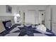 Bedroom with a queen bed, private bathroom access, and plenty of closet space at 9621 Shore Dr. # G219, Myrtle Beach, SC 29572
