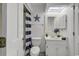 Bathroom with a shower/tub combo, white vanity, and nautical-themed decor at 9621 Shore Dr. # G219, Myrtle Beach, SC 29572