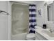 Clean bathroom with a shower/tub combo, white vanity, and nautical-themed decor at 9621 Shore Dr. # G219, Myrtle Beach, SC 29572