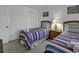 Bedroom with two twin beds, a dresser, and colorful bedding at 9621 Shore Dr. # G219, Myrtle Beach, SC 29572