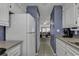 View down a galley kitchen, showing appliances and dining area at 9621 Shore Dr. # G219, Myrtle Beach, SC 29572