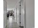 Bright hallway with tiled floors and doors leading to living area and bedrooms at 9621 Shore Dr. # G219, Myrtle Beach, SC 29572