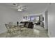 Dining area with glass-top table and four chairs, adjacent to living room at 9621 Shore Dr. # G219, Myrtle Beach, SC 29572