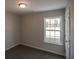 Bright bedroom with carpet flooring and large window at 318 Barn Owl Way, Conway, SC 29527