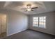 Spacious bedroom with ceiling fan and large window at 318 Barn Owl Way, Conway, SC 29527