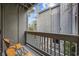 Private balcony with two chairs, offering a partial view of the complex at 7300 Porcher Dr. # 8, Myrtle Beach, SC 29572