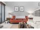 Living room with orange couch, off-white chairs, and coffee table at 7300 Porcher Dr. # 8, Myrtle Beach, SC 29572