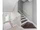 Modern staircase with dark wood steps and white risers at 7300 Porcher Dr. # 8, Myrtle Beach, SC 29572