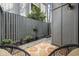 Cozy patio with two wicker chairs and potted plants at 7300 Porcher Dr. # 8, Myrtle Beach, SC 29572