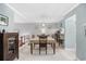 Bright dining room with table and chairs, view into kitchen at 7300 Porcher Dr. # 8, Myrtle Beach, SC 29572