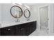 Modern bathroom with double vanity and marble floors at 7300 Porcher Dr. # 8, Myrtle Beach, SC 29572