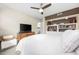 Main bedroom with built-in shelving and TV at 7300 Porcher Dr. # 8, Myrtle Beach, SC 29572