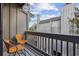 Private balcony with two chairs, offering a partial view of the complex at 7300 Porcher Dr. # 8, Myrtle Beach, SC 29572