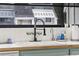 Kitchen sink with gooseneck faucet and tile backsplash at 7300 Porcher Dr. # 8, Myrtle Beach, SC 29572