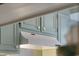 Close up of teal kitchen cabinets and range hood at 7300 Porcher Dr. # 8, Myrtle Beach, SC 29572