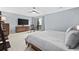 Bright bedroom with a king-size bed, large TV, and access to a balcony at 7300 Porcher Dr. # 8, Myrtle Beach, SC 29572