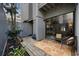 Relaxing patio with wicker chairs, potted plants, and access to the interior at 7300 Porcher Dr. # 8, Myrtle Beach, SC 29572