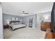 Spacious main bedroom with a king-size bed and plenty of natural light at 7300 Porcher Dr. # 8, Myrtle Beach, SC 29572