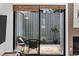 Private patio with wicker chairs and potted plants at 7300 Porcher Dr. # 8, Myrtle Beach, SC 29572
