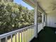 Screened balcony overlooking trees and lawn at 1525 Lantern Rest Dr. # 301, Myrtle Beach, SC 29579