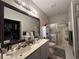 Bathroom with double vanity, shower, and mirror at 1525 Lantern Rest Dr. # 301, Myrtle Beach, SC 29579