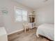 Small bedroom with full bed and wicker chair at 4105 S Ocean Blvd. S # 102, North Myrtle Beach, SC 29582