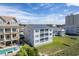 Aerial view of building, showcasing location near beach at 4105 S Ocean Blvd. S # 102, North Myrtle Beach, SC 29582