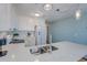 White kitchen with double sink, updated appliances and quartz countertops at 4105 S Ocean Blvd. S # 102, North Myrtle Beach, SC 29582