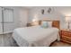 Bedroom with full bed and wood nightstands at 4105 S Ocean Blvd. S # 102, North Myrtle Beach, SC 29582