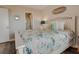 Bedroom with coastal bedding, and en-suite bathroom access at 4105 S Ocean Blvd. S # 102, North Myrtle Beach, SC 29582