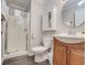 Clean bathroom with shower, toilet and wood vanity at 4105 S Ocean Blvd. S # 102, North Myrtle Beach, SC 29582