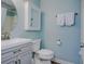 Clean bathroom with gray vanity, and white toilet at 4105 S Ocean Blvd. S # 102, North Myrtle Beach, SC 29582