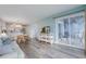 Living room with access to balcony and ocean view at 4105 S Ocean Blvd. S # 102, North Myrtle Beach, SC 29582