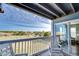 Covered balcony with rocking chairs and ocean view at 4105 S Ocean Blvd. S # 102, North Myrtle Beach, SC 29582