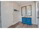 Bright entryway with charming blue cabinet and beach decor at 4105 S Ocean Blvd. S # 102, North Myrtle Beach, SC 29582