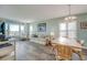Bright living room with ocean view, comfy sofa, and dining area at 4105 S Ocean Blvd. S # 102, North Myrtle Beach, SC 29582