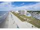 Wide aerial showcasing beach, ocean, and beachfront high-rise buildings at 4105 S Ocean Blvd. S # 102, North Myrtle Beach, SC 29582