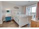 Bedroom with coastal decor, queen bed, and access to balcony at 4105 S Ocean Blvd. S # 102, North Myrtle Beach, SC 29582