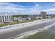Aerial perspective of beachfront properties, including high-rises and smaller buildings at 4105 S Ocean Blvd. S # 102, North Myrtle Beach, SC 29582