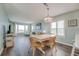 Bright dining area with hardwood floors, light walls, and ocean view at 4105 S Ocean Blvd. S # 102, North Myrtle Beach, SC 29582