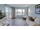 Bright living room with ocean view, comfy seating, and hardwood floors at 4105 S Ocean Blvd. S # 102, North Myrtle Beach, SC 29582