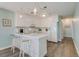 Modern white kitchen with breakfast bar and stainless steel appliances at 4105 S Ocean Blvd. S # 102, North Myrtle Beach, SC 29582